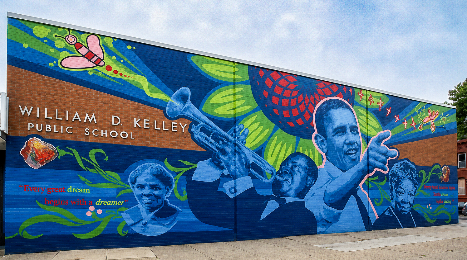 Colorful mural on the exterior of William D. Kelley School featuring portraits of prominent Black leaders, artists and historical figures.